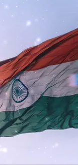 Indian flag waving against a starry sky.