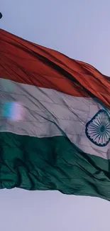 Indian flag waving against a clear sky.