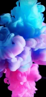 Vibrant blue and pink ink cloud on black background.