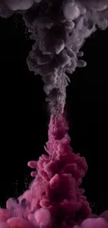 Abstract ink flow in pink and gray on black background.