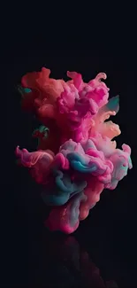 Vibrant pink and blue ink swirling against a dark background.