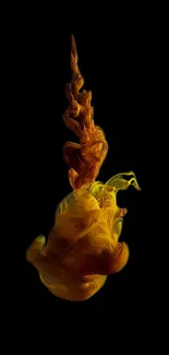 Vibrant yellow and orange ink swirling against a black background.