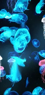 Vibrant blue jellyfish wallpaper with glowing marine creatures.