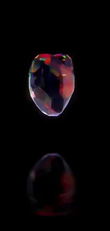 Colorful gemstone on a black background wallpaper.