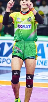 Kabaddi player in vibrant green and yellow uniform on the field.