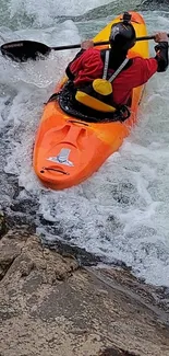 Kayaker in an orange kayak navigating river rapids with splashing water.