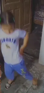 Child energetically dancing on rustic floor.