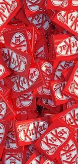 Bright KitKat candy stacks forming a vibrant mobile wallpaper.