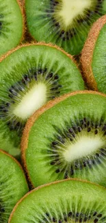 Close-up of vibrant green kiwi slices, creating a fresh and natural mobile wallpaper.