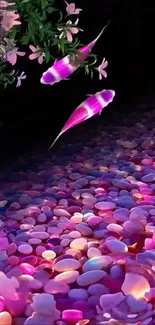 Colorful koi fish swim above vibrant stones.