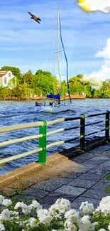 Serene lakeside view with sailboat under blue sky and lush greenery.