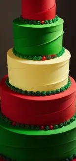 Vibrant layered cake with red, green, and yellow tiers in bright festive colors.