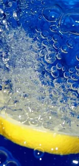 Lemon slice with bubbles in blue water on a phone wallpaper.