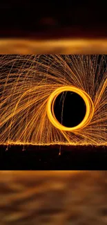 Vibrant circular light trails wallpaper with orange sparks on a dark background.