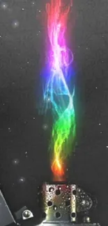 Vibrant rainbow flame from a lighter on a black background.