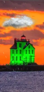 Vibrant green lighthouse under orange sunset with rain on the sea.