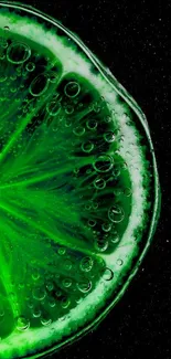 Close-up of a vibrant lime slice on a black background.