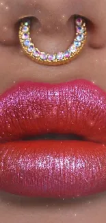 Close-up of lips with vibrant pink-red shades and sparkling jewelry.