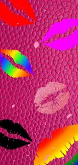 Vibrant mobile wallpaper with colorful lip prints on pink texture.