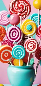 Colorful lollipop bouquet with vibrant spirals in teal vase.