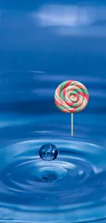 Colorful lollipop hovering over a blue water ripple effect.