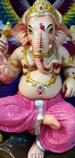 Colorful Lord Ganesha statue with pink attire and intricate details.