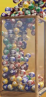 Colorful lottery balls cascading in a glass case with vibrant background.