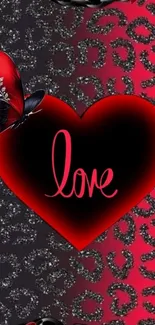 Red heart with 'love' text on glittery leopard print background.