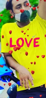 Yellow t-shirt with 'LOVE' and red hearts wallpaper.