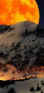 Vibrant orange moon over snowy mountains under a dark night sky.