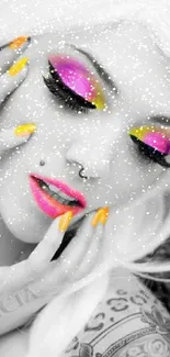 Bold artistic portrait with colorful makeup and vibrant nails.