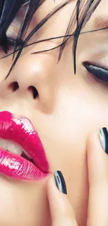 Close-up of vibrant makeup with bold pink lips and striking black eyeliner.