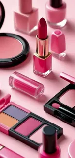 Assorted makeup items on pink background.