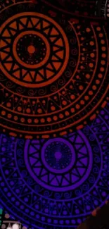 Colorful mandala pattern with vibrant design in black and purple hues.