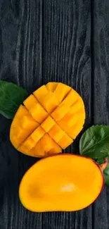 Sliced mango with leaves on dark wood background, vibrant phone wallpaper.