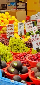 Colorful variety of fruits at a market stall.
