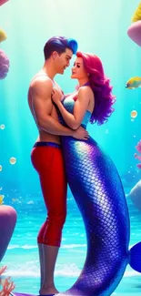 Vibrant underwater wallpaper featuring a mermaid couple embracing.