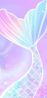 Mermaid tail with pastel colors on pink background.