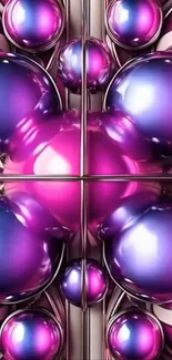Vibrant metallic spheres in pink and blue hues on a mobile wallpaper.