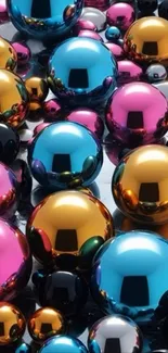 Colorful metallic spheres in blue, pink, and gold.