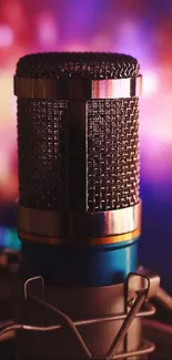 Close-up of a studio microphone with vibrant background.