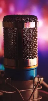 Close-up of a professional microphone with vibrant background.