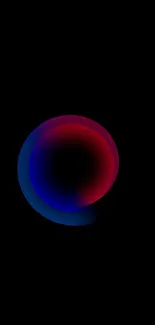 Minimalist wallpaper with a glowing red and blue orb on a black background.