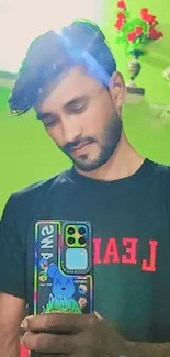 Man taking a mirror selfie with colorful phone case.