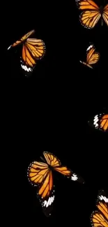 Monarch butterflies on a sleek black background, perfect for mobile display.