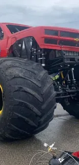 Vibrant monster truck on display with large tires and bold colors.