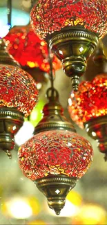 Red mosaic hanging lanterns emitting warm light.