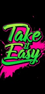 Neon 'Take It Easy' text with vibrant colors on black background.