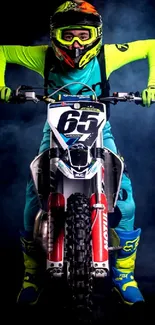 Motocross rider with neon gear and motorcycle in a smoky background.