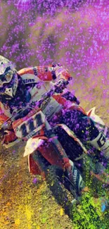 Motocross rider in a splash of vibrant pink, orange, and purple colors on a dirt track.